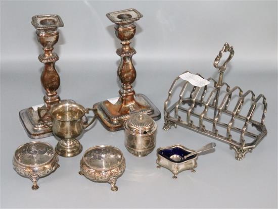 Silver mustard, pr of silver salts & spoons, 2 x silver condiments, a small silver cup, plated toastrack and pr of plated candlesticks.